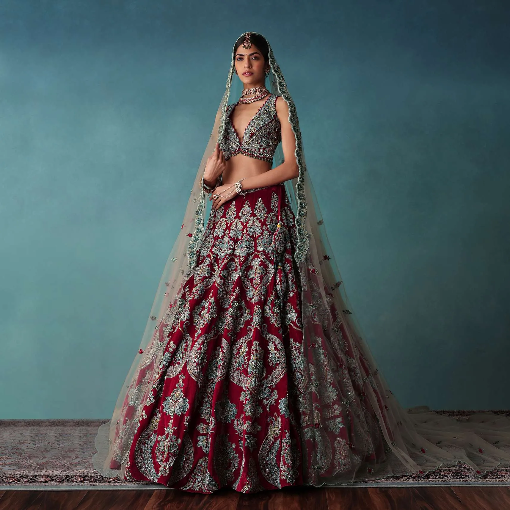Deep Red Hand Embroidered Bridal Lehenga And blouse Set In Velvet
